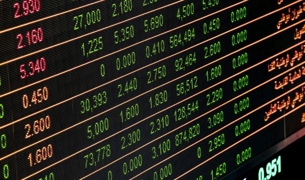 Digital stock market board showing various financial data and prices.